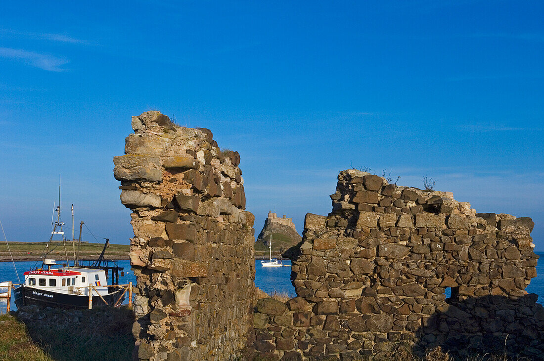 Lindesfarne Castle Seen Through Breach In Stone Wall, Holy Island,Northumberland,Uk