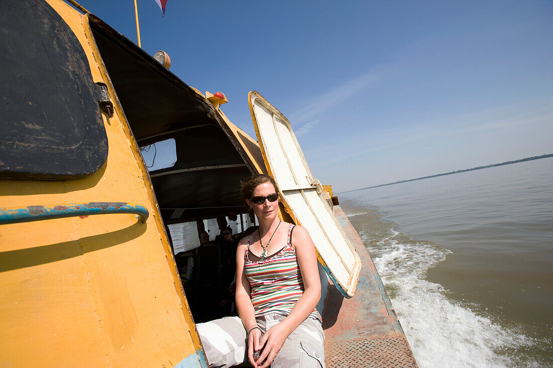 Woman On Boat On Mekong River, Cambodia/Vietnam Border,Vietnam