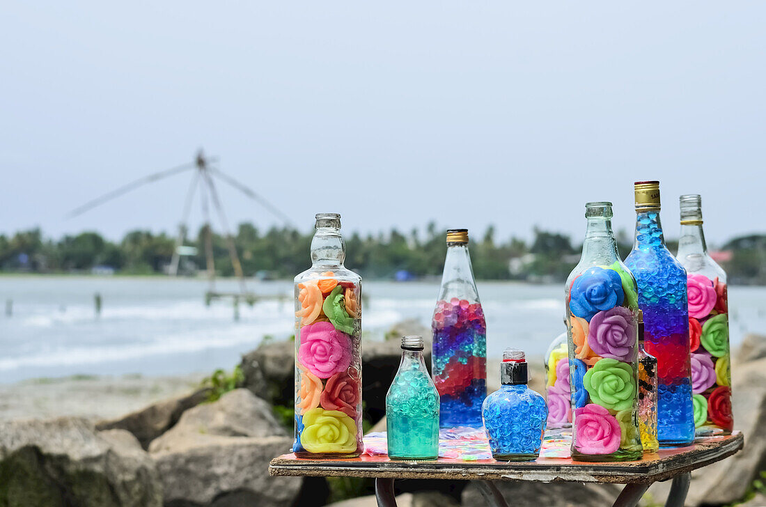 Decorated Glass Bottles With Colorful Roses; Kochi, Ernakulam District, Kerala, India