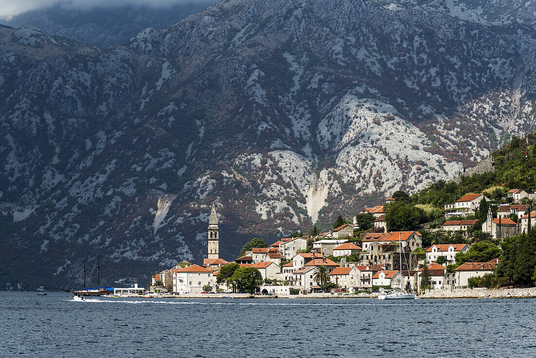 Bay of Kotor with buildings in the city of Perast along the coastline; Perast, Kotor Municipality, Montenegro