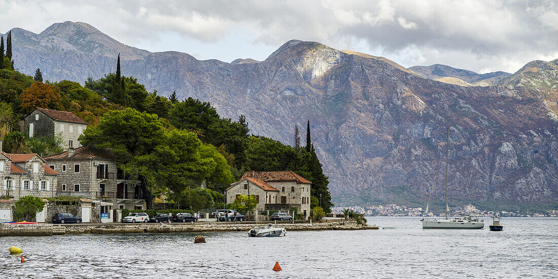 Houses and boats along the Bay of Kotor; Perast, Kotor, Montenegro