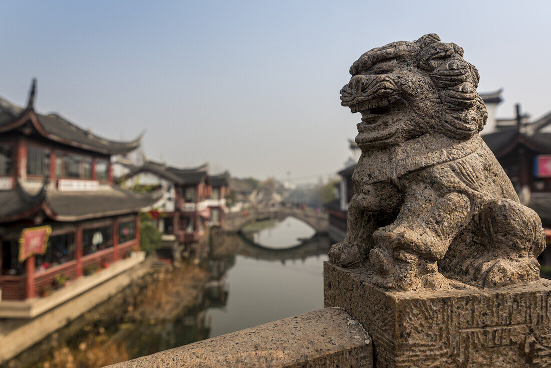 Lion sculpture on one of Qibao Old Town bridges, Minhang District; Shanghai, China