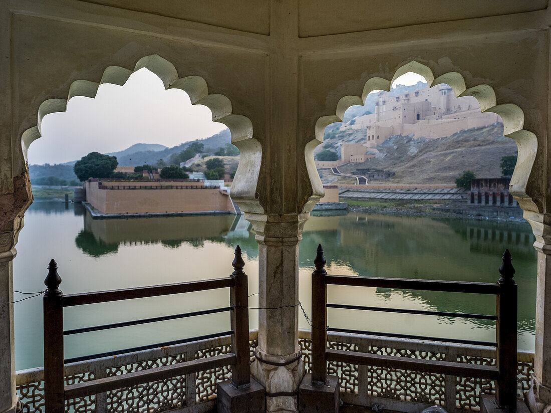 Maota Lake in front of Amer Fort viewed through scalloped archways; Jaipur, Rajasthan, India