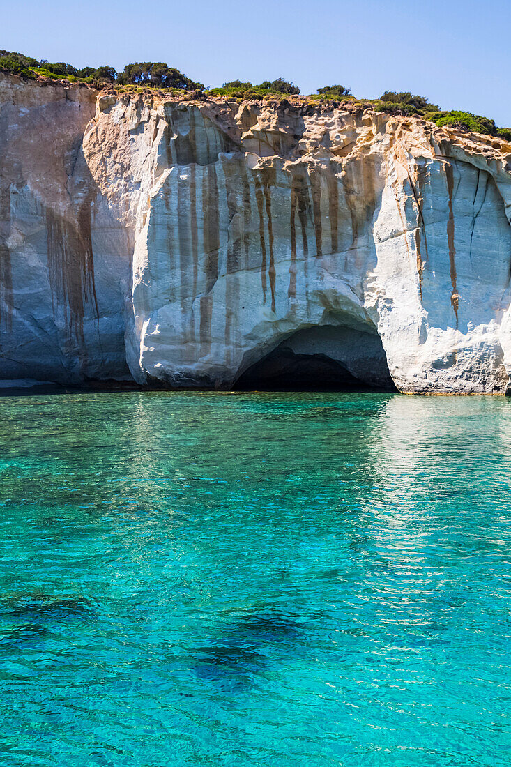 Tourist snorkelling in Kleftiko Bay; Milos Island, Cyclades, Greece