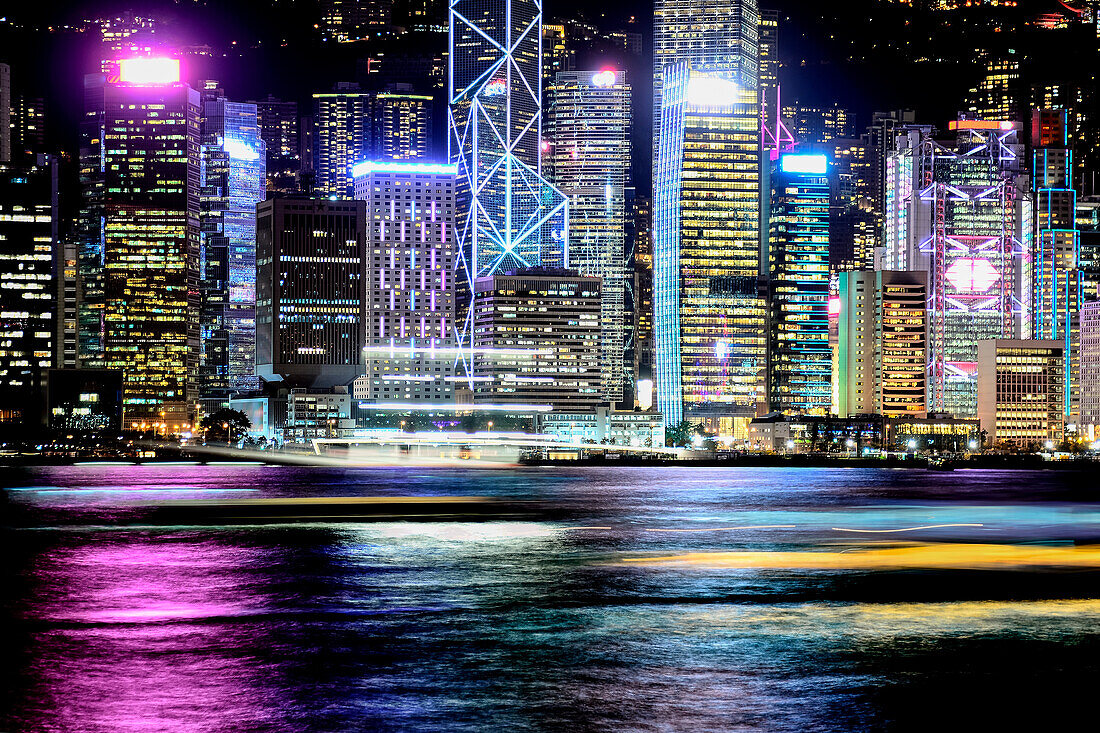 Night view of Hong Kong and moving light trails of boats; Hong Kong, Hong Kong Special Administrative Region (SAR), Hong Kong
