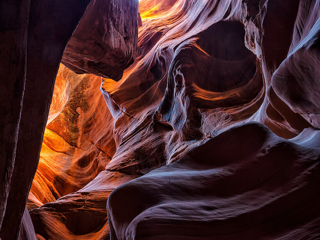 A slot canyon outside of Page, Arizona. Beautiful colours and sandstone caused by eons of wind and water erosion; Page, Arizona, United States of America
