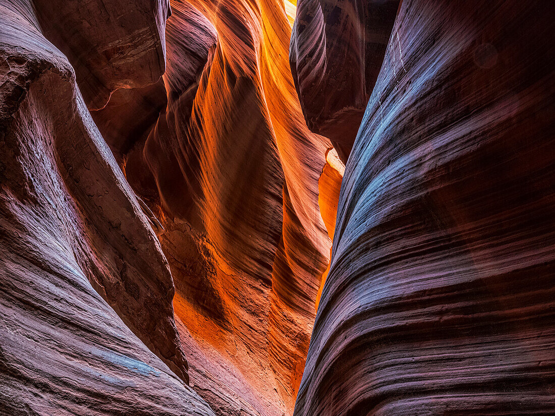 A slot canyon outside of Page, Arizona. Beautiful colours and sandstone caused by eons of wind and water erosion; Page, Arizona, United States of America