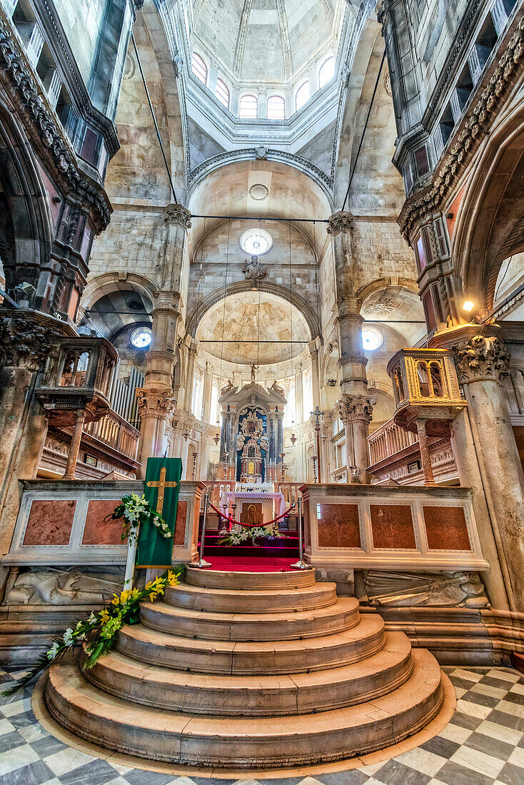 Interior of the Cathedral of St James with its magnificent dome and arched stonework showing semi-circular stairs leading to one of the altars in this triple-nave, 15th Century, Gothic-Renaissance church; Sibenik, Croatia