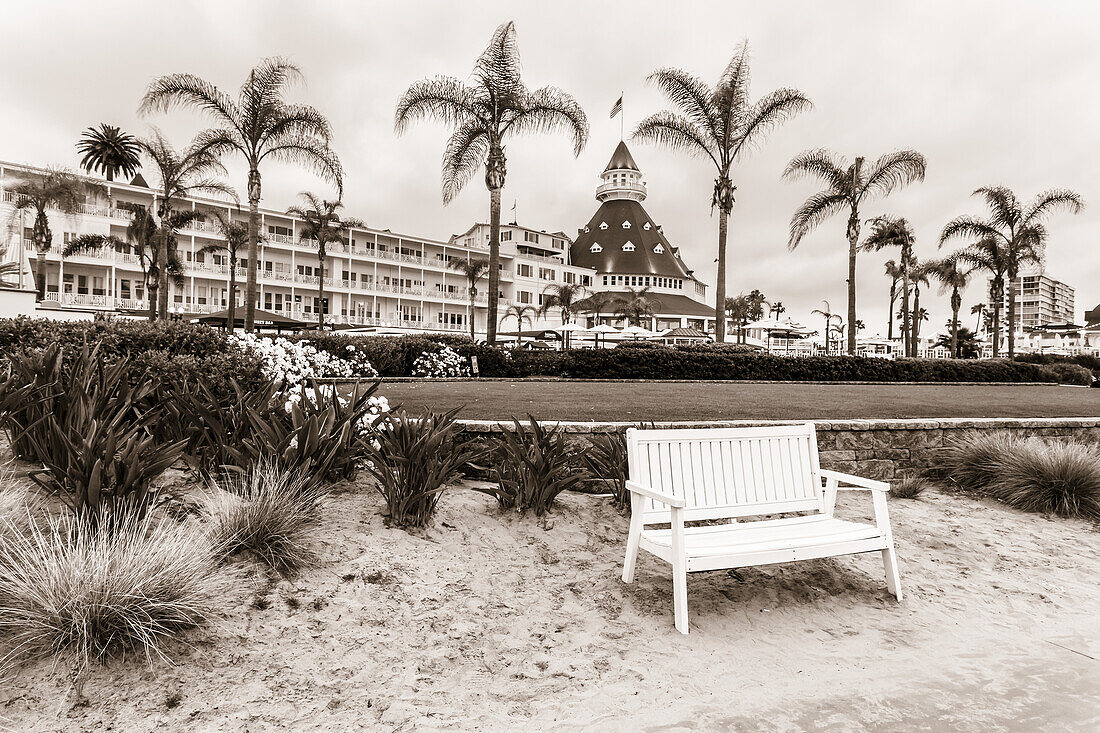 Wooden bench on the beach in front of the iconic Hotel del Coronado; Coronado, California, United States of America