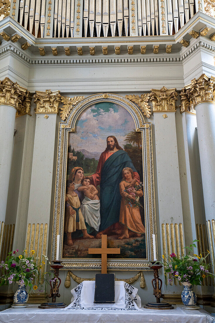 Interior of the Viscri Fortified Saxon Church, showing the altar with a religious painting, The Blessing of the Children by J. Paukratz added in the 19th Century; Viscri, Brasov County, Transylvania, Romania