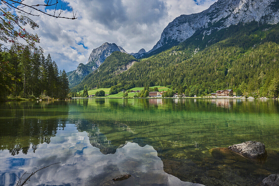 Clear Waters of Lake Hintersee with lodges along the shoreline in the Bavarian Alps; Berchtesgadener Land, Ramsau, Bavaria, Germany