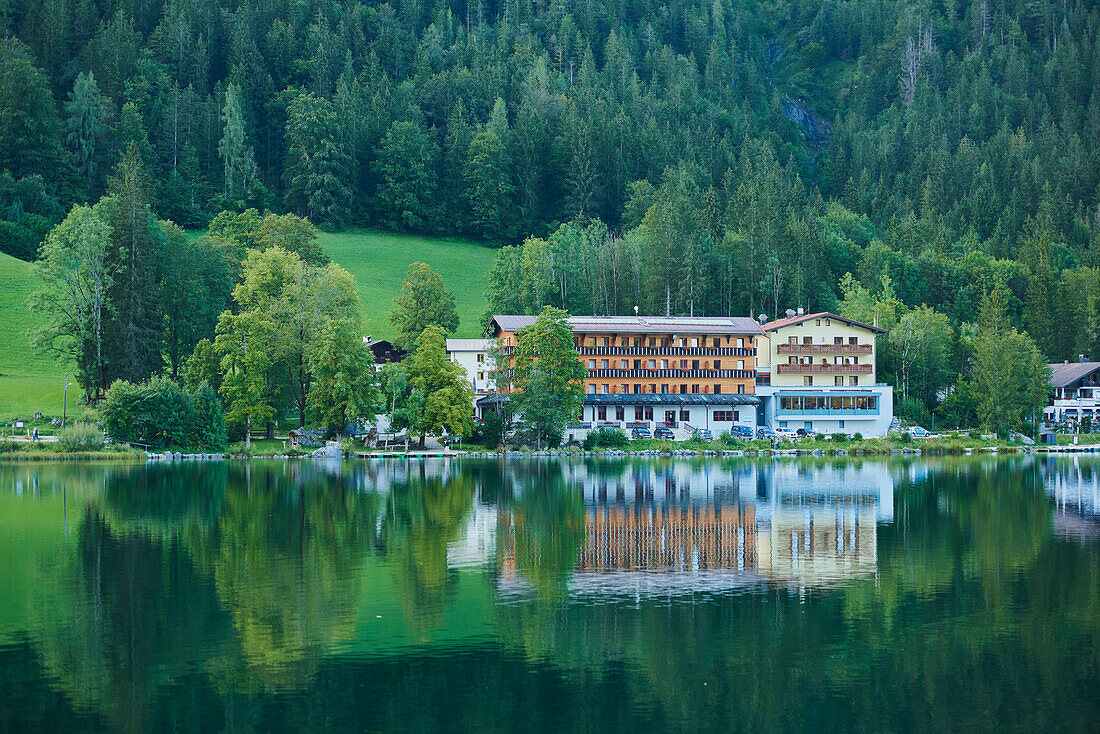 Hotel along the shoreline at Lake Hintersee in the Bavarian Alps; Berchtesgadener Land, Ramsau, Bavaria, Germany