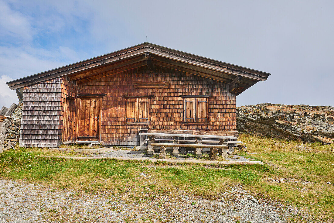 An old wooden cottage at Mount Schüttenhöhe in the mountains above Zell am See, Kaprun; Salzburg State, Austria