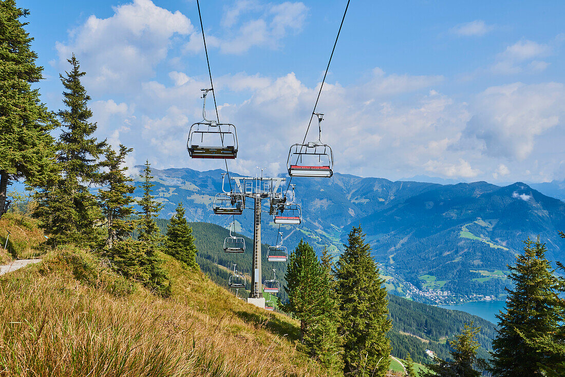 Ski lift on Mount Schüttenhöhe with view of mountains above Zell am See, Kaprun; Salzburg State, Austria