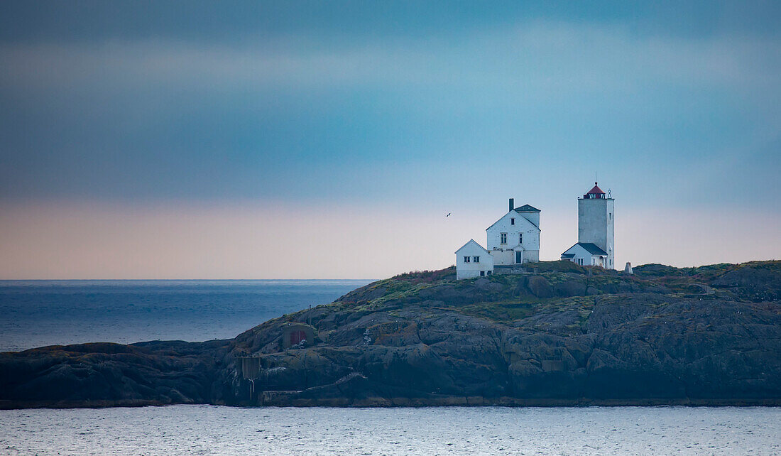 Terningen Lighthouse at twilight on a remote island in the Municipality of Hitra near the mouth of the Hemnfjorden in the Western Fjords of Norway; Sor-Trondelag, Trondelag, Norway