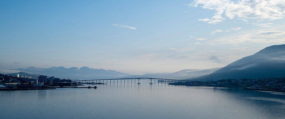 The Tromso Bridge crossing the Tromsoysundet Strait between Tromsdalen on the mainland and the Island of Tromsoya in the port town of Tromso north of the Arctic Circle on the west coast of Norway; Tromso, Troms og Finnmark, Norway