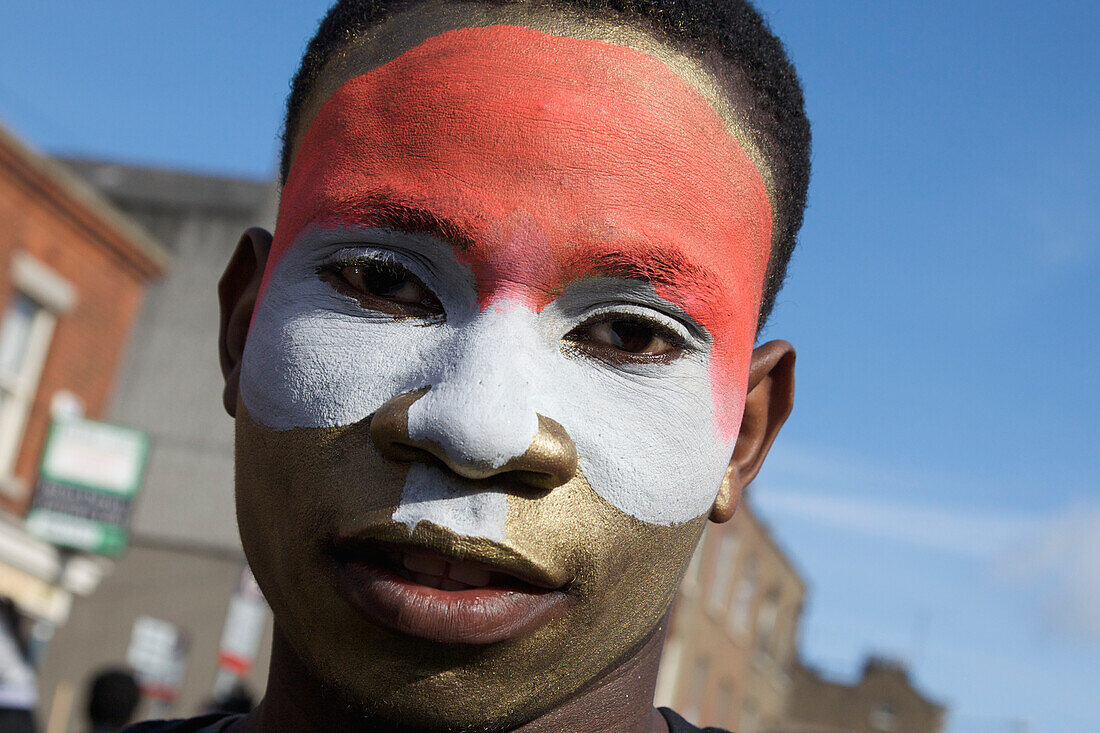 A Person With Face Painted For The Saint Patrick's Day Parade; Dublin Ireland