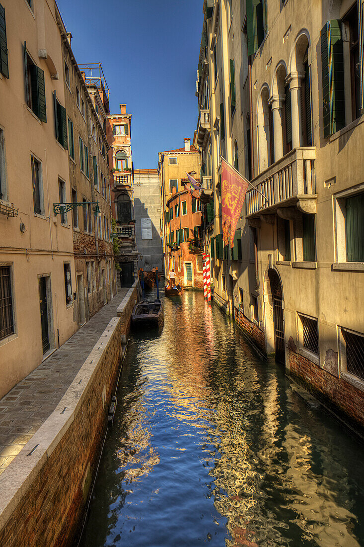 Gondola In A Canal; Venice Italy