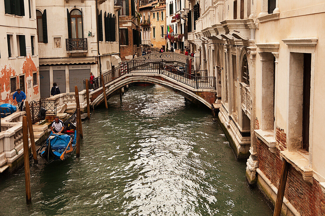 Gondola And Footbridge Over The Canal; Venice Italy