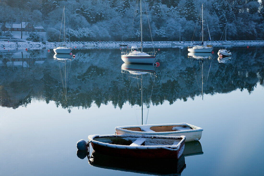 Boats Moored On Tranquil Water In The Winter; County Cork Ireland