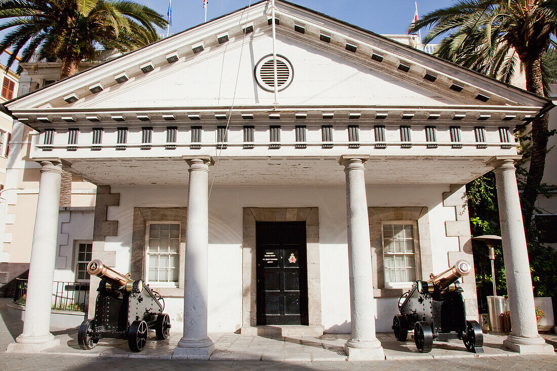 A White Building With Cannons Displayed Outside; Gibraltar