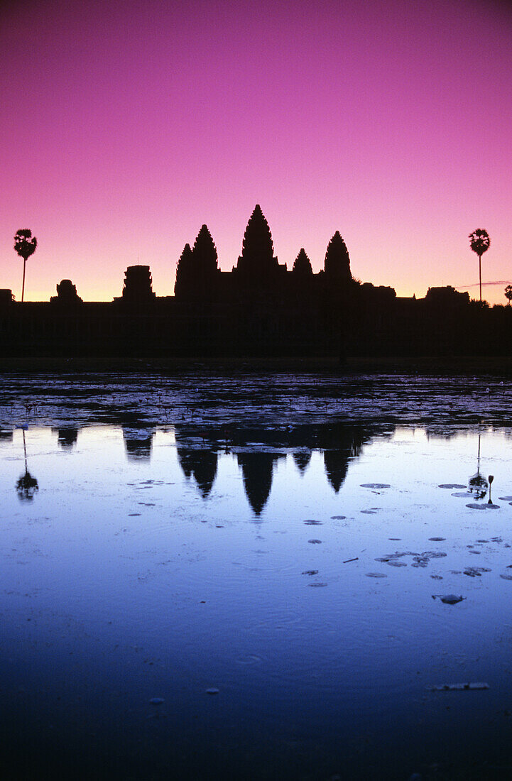 Cambodia, Angkor Wat, Silhouette Of Temple At Sunrise.