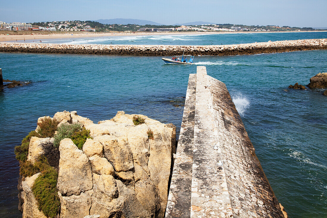 A Boat Travelling Along The Coast; Lagos Algarve Portugal