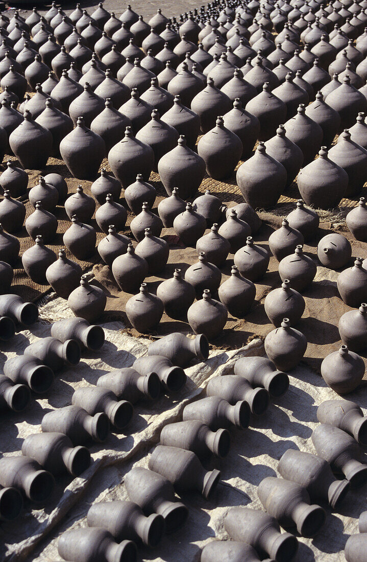 Nepal, Potter's Square; Bhaktapur, Vases of various sizes lined up in rows potters