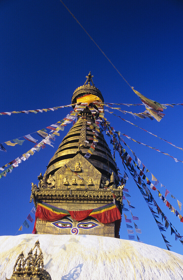 Nepal, Colorful flags hanging from top on Swayambhunath Stupa; Kathmandu