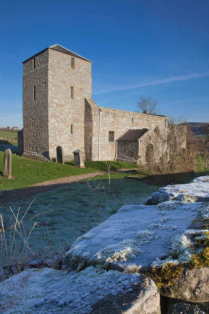 A Church And Cemetery With Frost On The Grass And Stone Wall; Eglingham Northumberland England