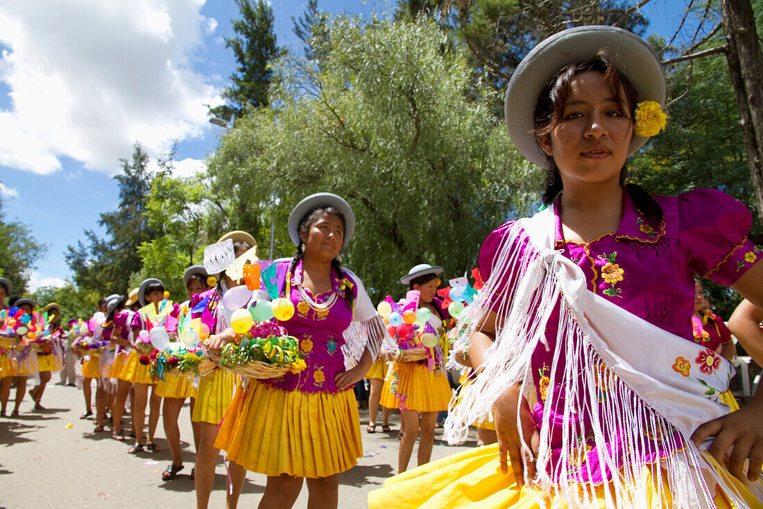 Girls Carrying Festive Baskets In The Entrada De Comadritas Parade During The Carnaval Chapaco, Tarija, Bolivia