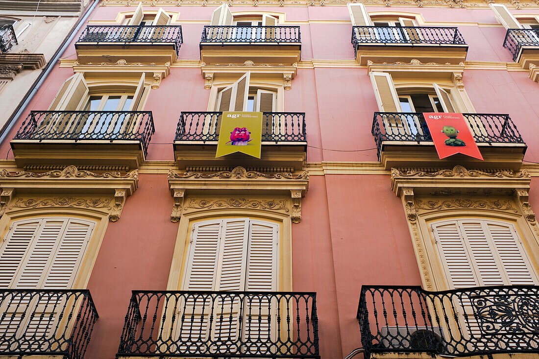 Low Angle View of Building Exterior with Large Windows and Shutters, Valencia, Spain