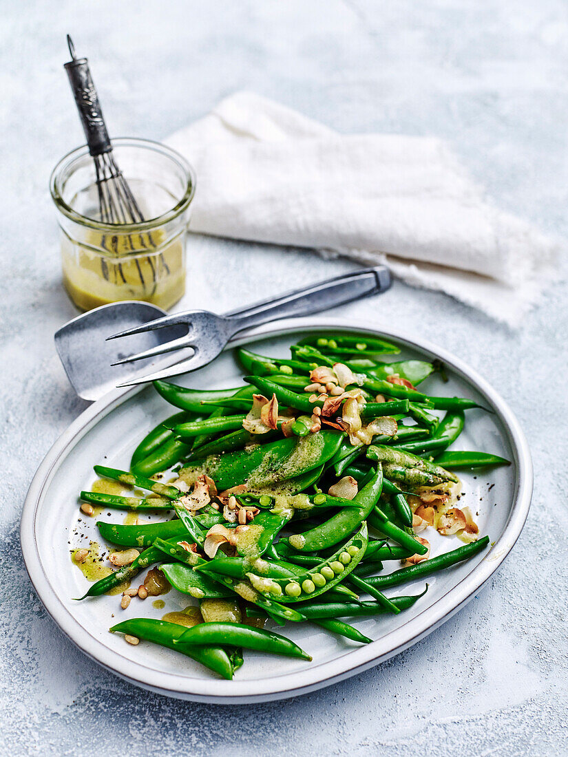 Garlicky green beans and peas with pine nuts