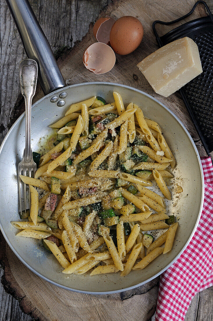 Italian pasta carbonara with zucchini and pancetta