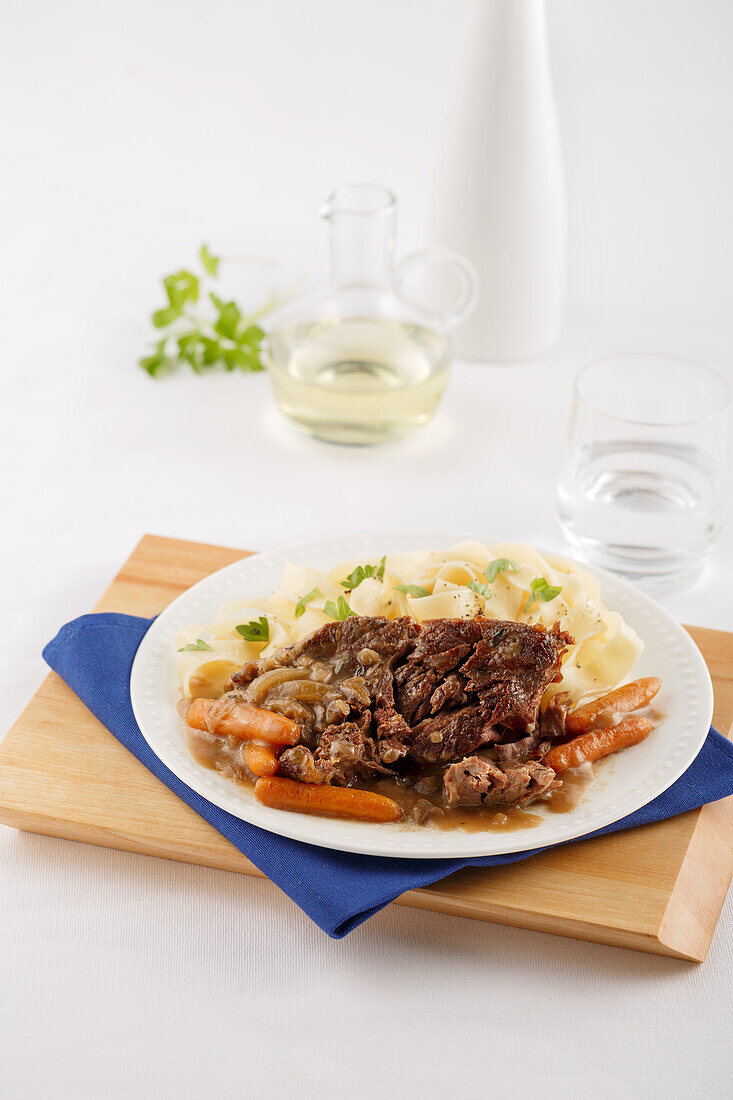 Roast beef with carrots and noodles