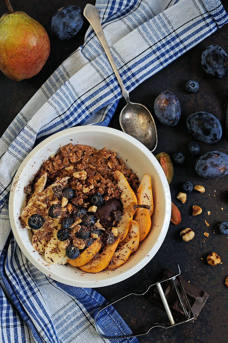 Chocolate porridge with fresh autumn fruit