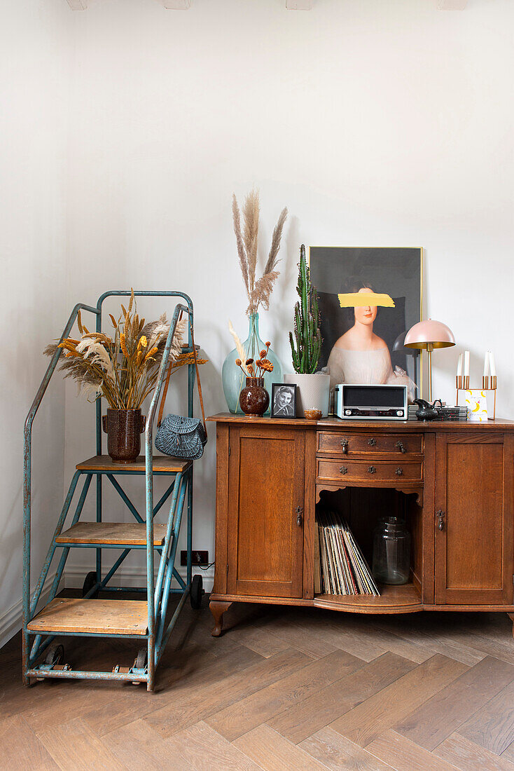 Antique cupboard next to vintage staircase