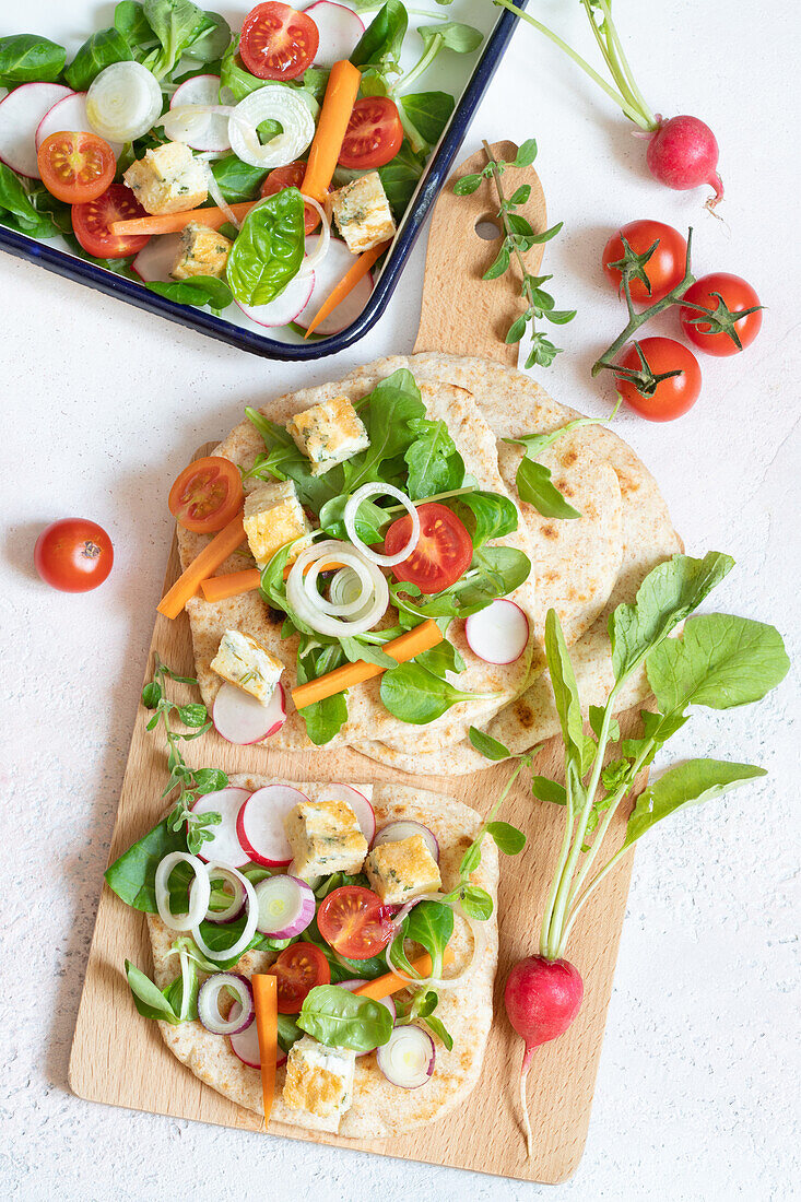 Homemade piadina with herb omelet and salad