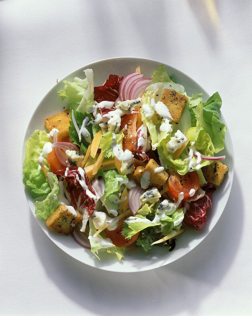 A Bowl of Tossed Salad with Dressing