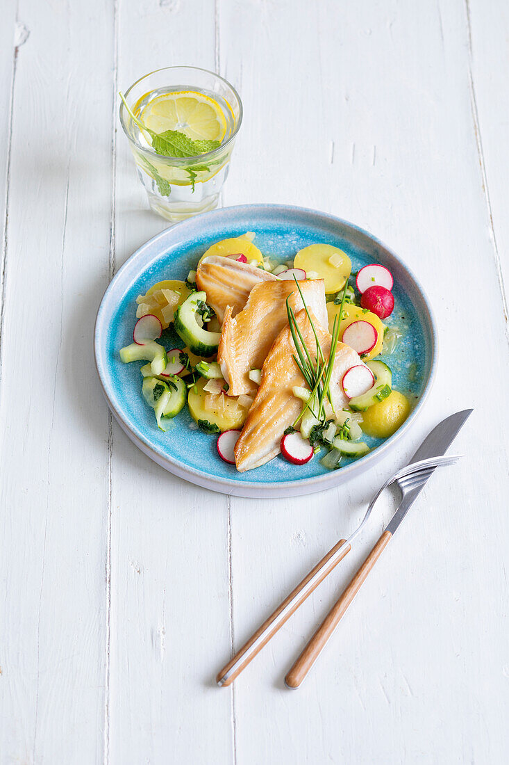 Potato salad with smoked trout fillet