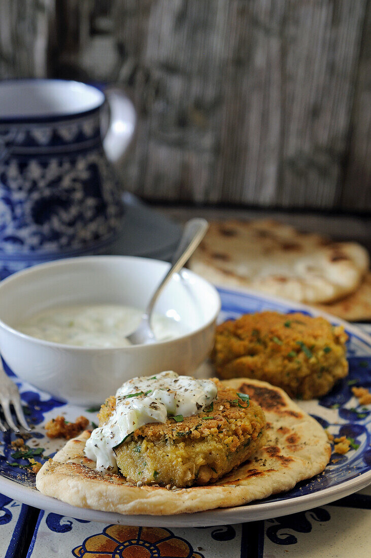 Falafel on pita bread with sour cream dip