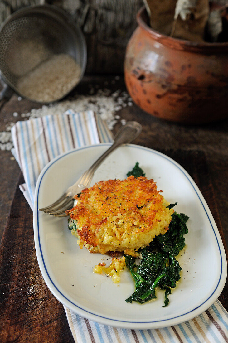 Crispy rice fritter over spinach