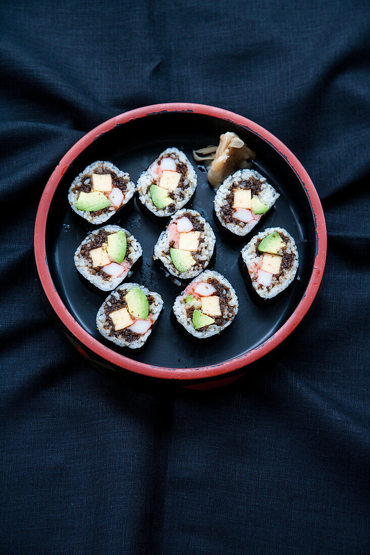 Maki sushi with avocado, crab meat, and omelette