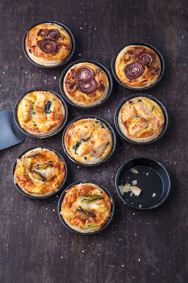 Three kinds of quiche with fish, seafood, and vegetables