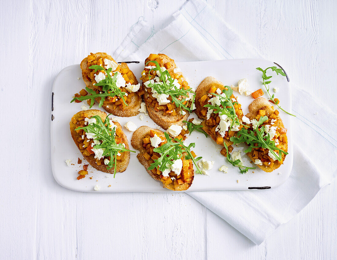 Pumpkin bruschetta with feta and rocket salad