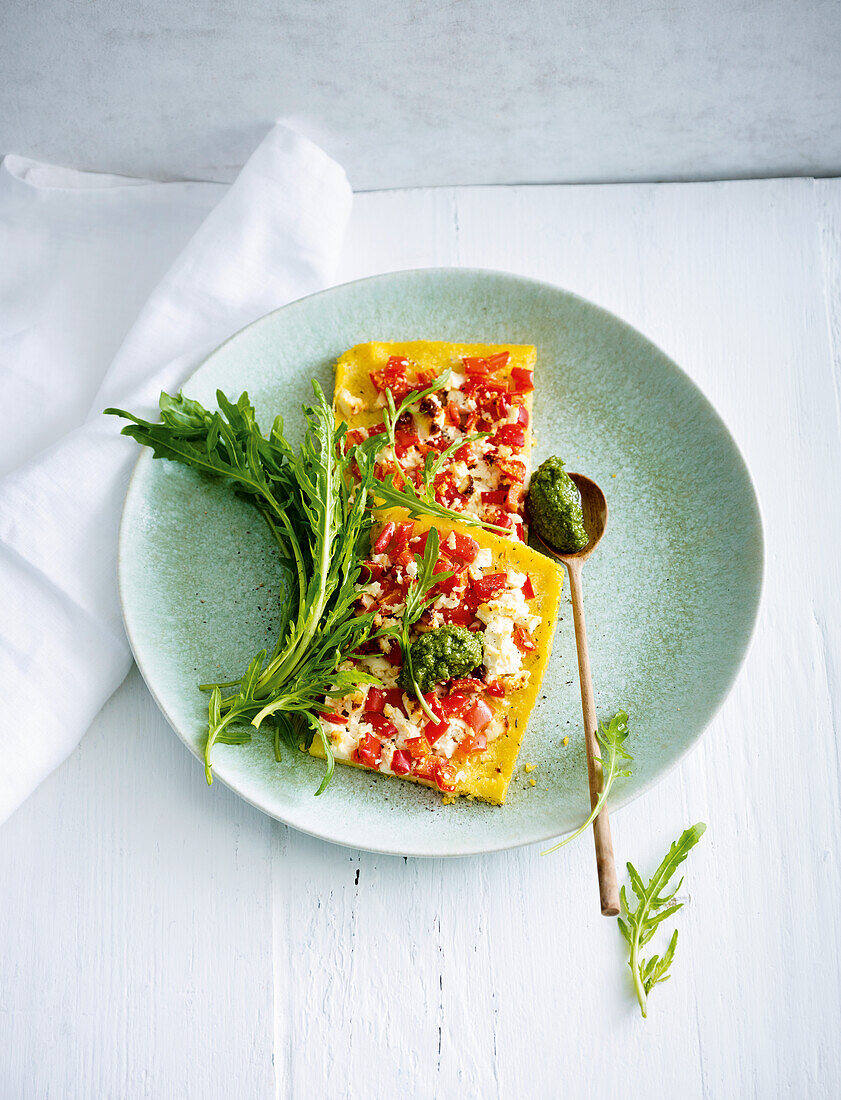 Polenta slices with feta and pesto