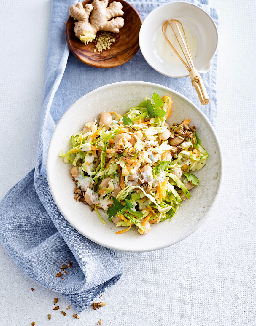 Pointed cabbage salad with giant beans and ginger dressing