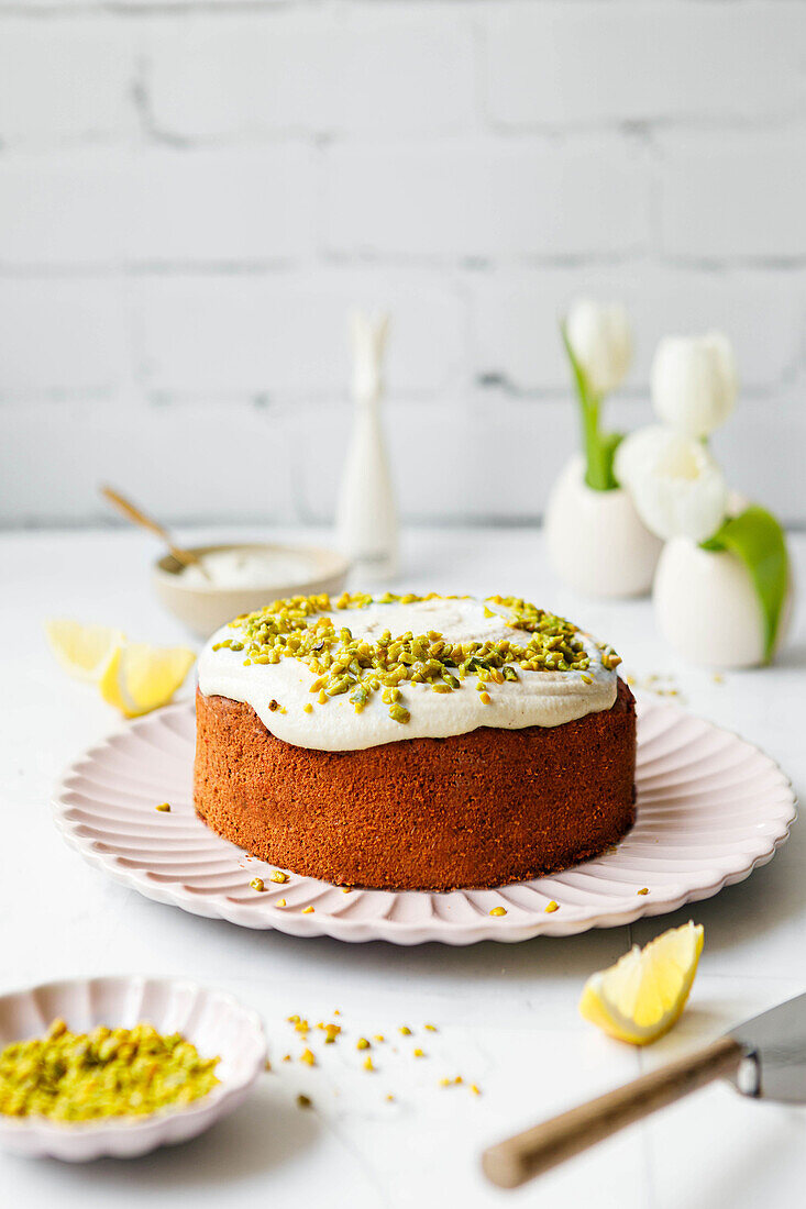 Carrot cake with pistachios and frosting
