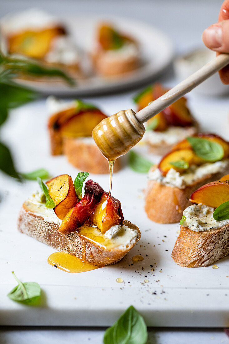 Peach crostini with herbs and cream cheese