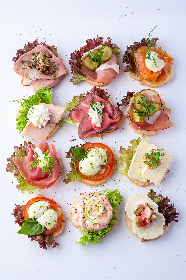 Canapes with fish, ham, roast beef and cheese